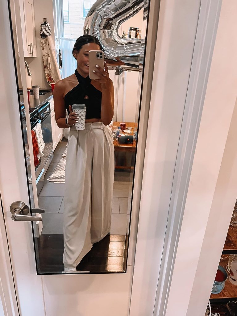 Black Criss-Cross Halter Top, Tan Wide-Leg Pants, and White Sneakers
