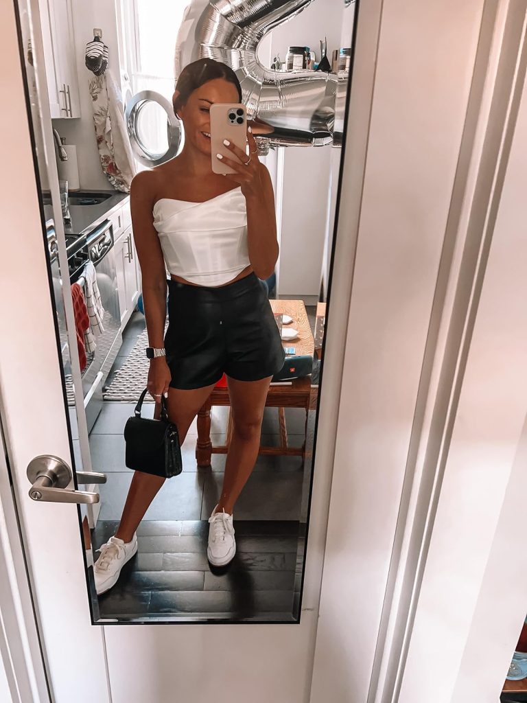 White Strapless Corset Top with Black Leather Shorts and White Sneakers