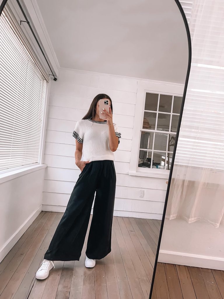 white and black short-sleeve sweater top with black palazzo pants