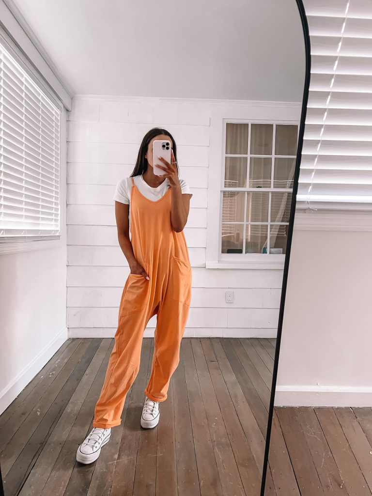orange romper with white t-shirt or white bodysuit underneath and sneakers